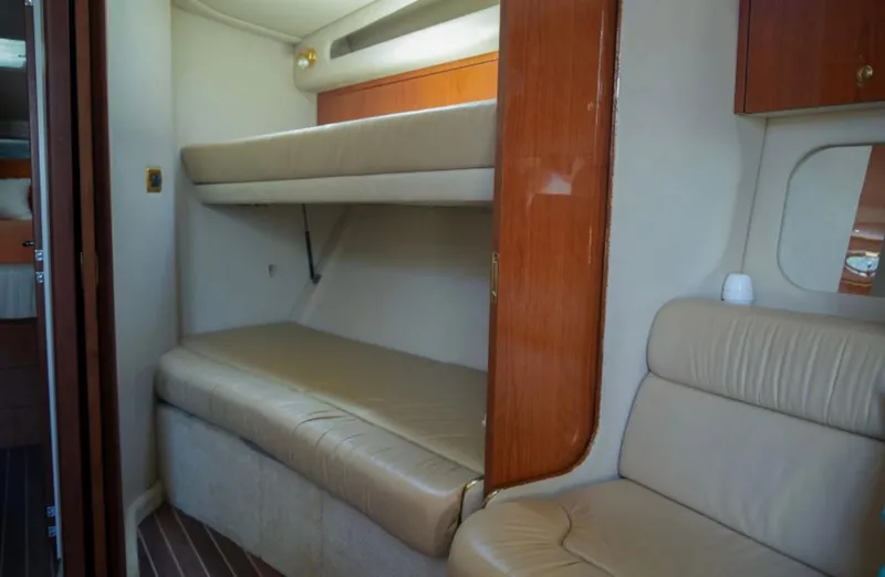  Yacht Photos Pics Interior of 2001 Sea Ray Express Cruiser with beige seating and wooden accents.