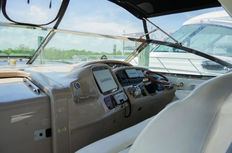  Yacht Photos Pics 2001 Sea Ray Express Cruiser cockpit with Garmin navigation system and luxurious seating.
