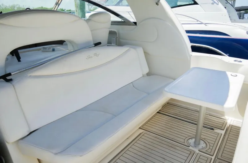  Yacht Photos Pics 2001 Sea Ray Express Cruiser interior with white seating and table.