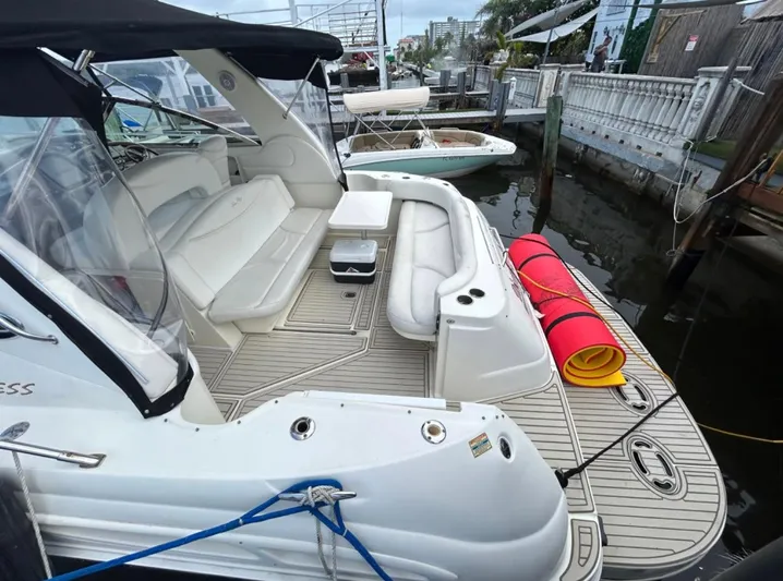  Yacht Photos Pics 2001 Sea Ray Express Cruiser docked, featuring spacious seating and deck area.