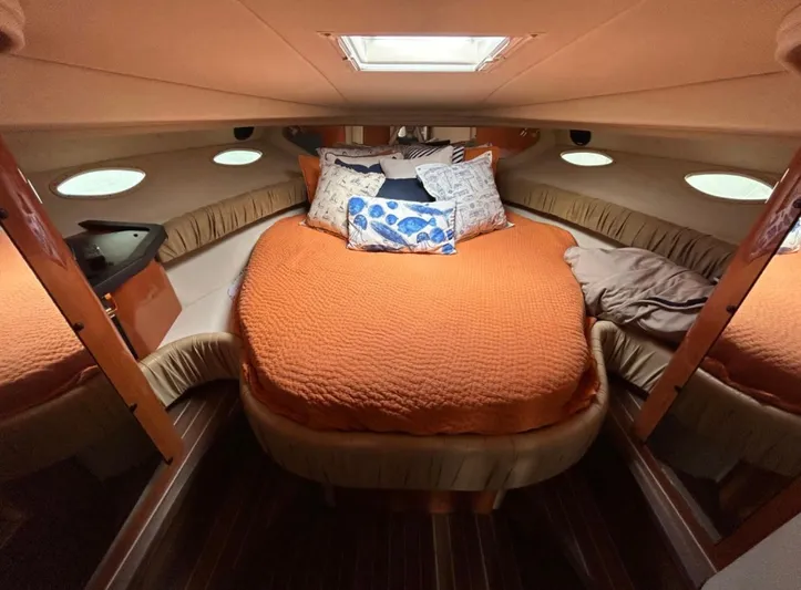  Yacht Photos Pics 2001 Sea Ray Express Cruiser cabin with cozy bed and orange bedding.