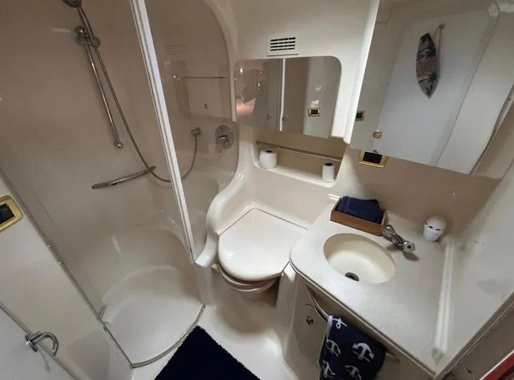  Yacht Photos Pics 2001 Sea Ray Express Cruiser bathroom with shower, sink, and storage.