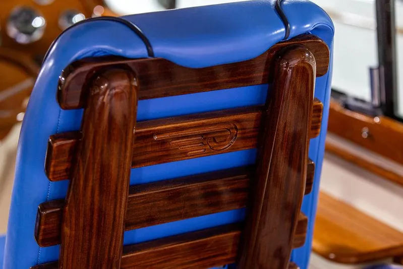 Valor Yacht Photos Pics Hinckley Talaria 34, 2014 model, featuring elegant wooden and blue leather seating.