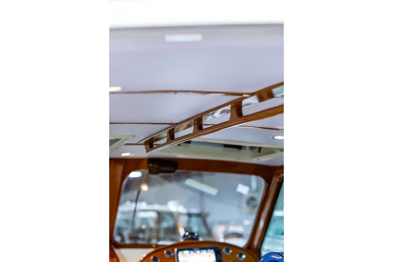 Valor Yacht Photos Pics Interior view of 2014 Hinckley Talaria 34, showcasing elegant woodwork and modern design.