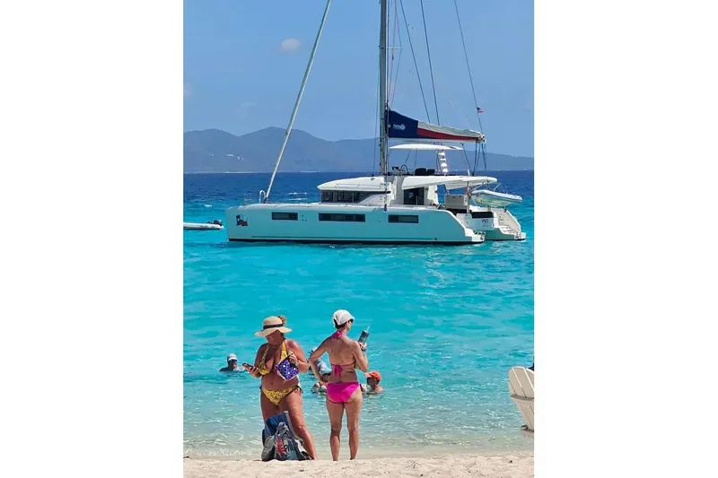 Lone Star Lagoon Yacht Photos Pics Beach scene with Lagoon 50 catamaran, 2019 model, anchored in turquoise waters.