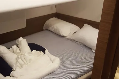 Lone Star Lagoon Yacht Photos Pics Cozy cabin bed in 2019 Lagoon 50 yacht with pillows and neatly arranged linens.