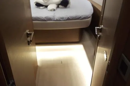 Lone Star Lagoon Yacht Photos Pics 2019 Lagoon 50 yacht interior cabin with bed and ambient lighting.