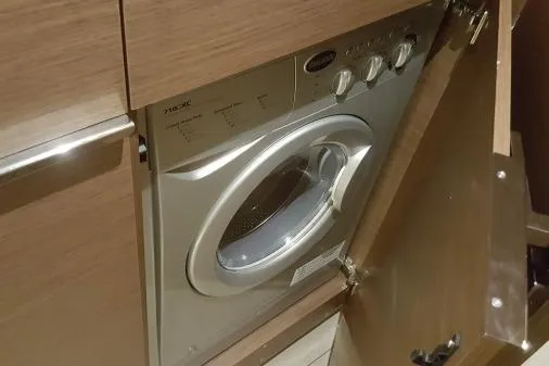 Lone Star Lagoon Yacht Photos Pics Built-in washing machine on 2019 Lagoon 50 yacht, wooden cabinetry.