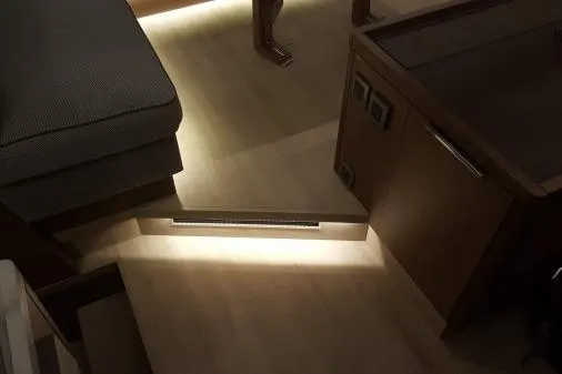 Lone Star Lagoon Yacht Photos Pics Interior of 2019 Lagoon 50 yacht with illuminated wooden steps and modern furnishings.