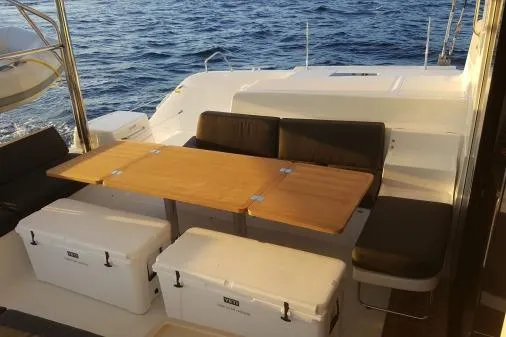 Lone Star Lagoon Yacht Photos Pics 2019 Lagoon 50 yacht deck with seating, table, and ocean view.
