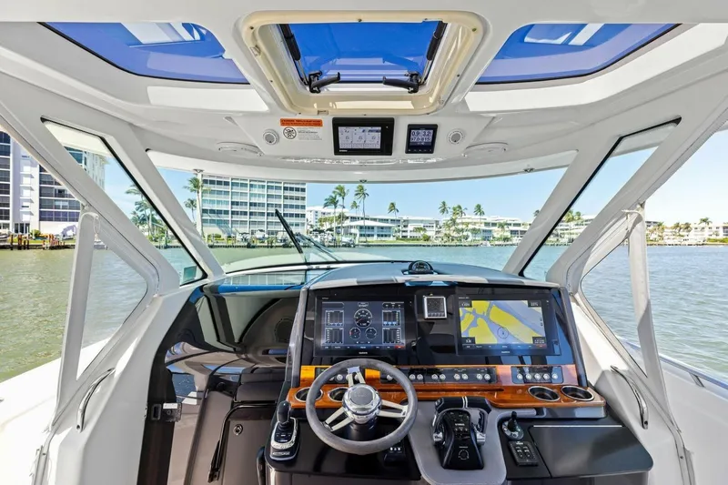 Luna B Yacht Photos Pics Interior view of 2018 Tiara Yachts 38 LS helm with modern navigation system.