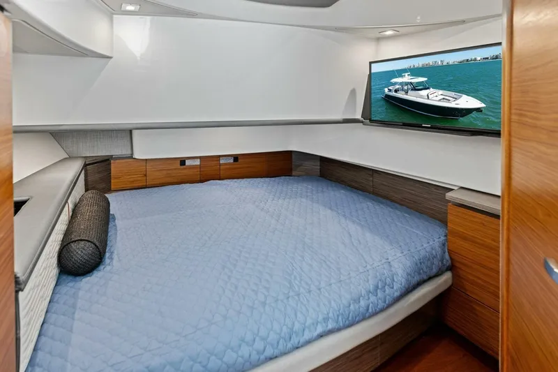 Luna B Yacht Photos Pics Luxurious cabin interior of 2018 Tiara Yachts 38 LS with bed and TV.