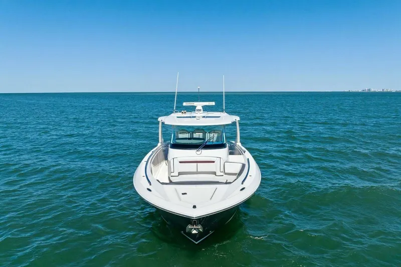 Luna B Yacht Photos Pics 2018 Tiara Yachts 38 LS on open water, clear blue sky background.