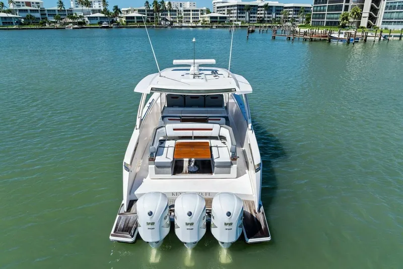 Luna B Yacht Photos Pics 2018 Tiara Yachts 38 LS on water, featuring triple outboard engines.