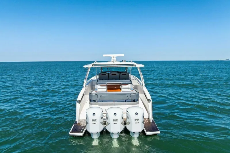 Luna B Yacht Photos Pics 2018 Tiara Yachts 38 LS on open water, showcasing triple V8 engines.