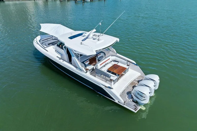 Luna B Yacht Photos Pics 2018 Tiara Yachts 38 LS boat with triple Yamaha engines on calm water.