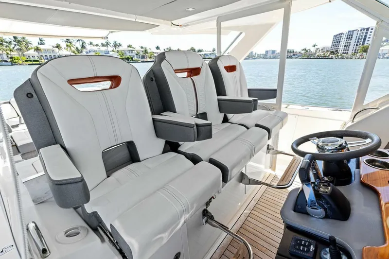 Luna B Yacht Photos Pics Luxurious helm seating on 2018 Tiara Yachts 38 LS, featuring modern design and controls.