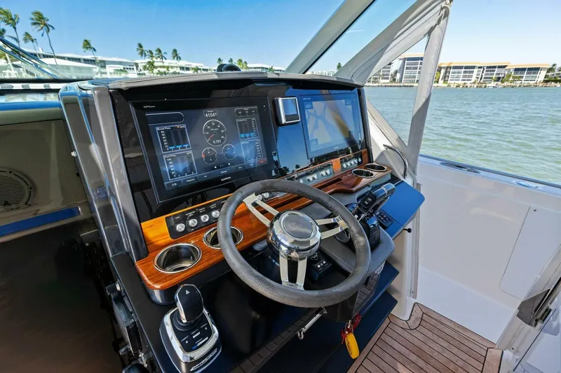 Luna B Yacht Photos Pics Helm of 2018 Tiara Yachts 38 LS with advanced navigation displays and controls.