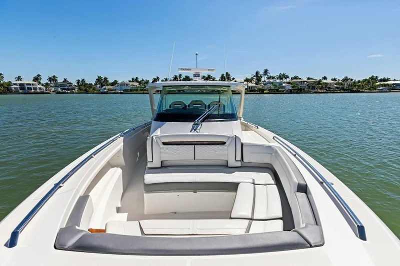 Luna B Yacht Photos Pics 2018 Tiara Yachts 38 LS on serene water, showcasing luxurious seating and sleek design.