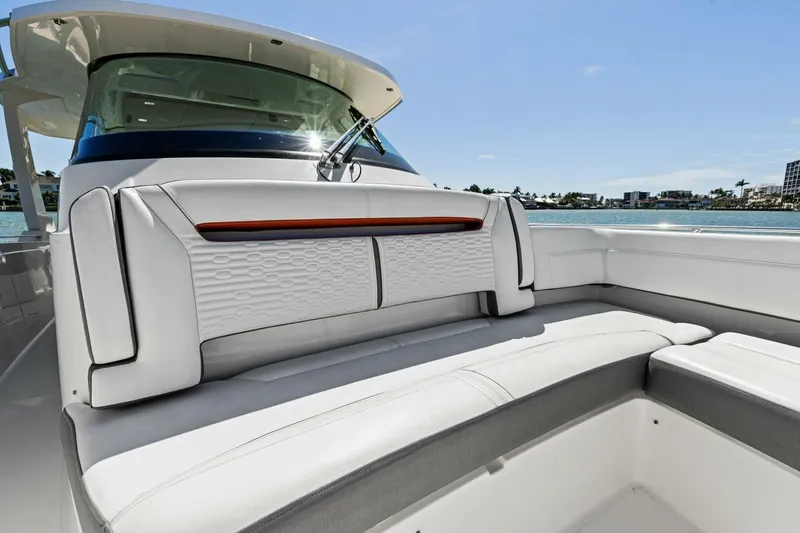 Luna B Yacht Photos Pics Luxurious seating on 2018 Tiara Yachts 38 LS, featuring elegant white upholstery.