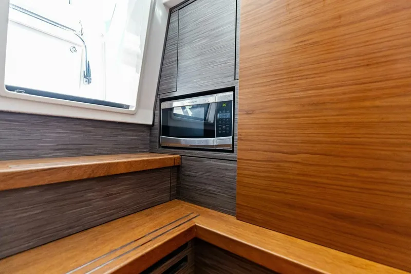 Luna B Yacht Photos Pics Interior of 2018 Tiara Yachts 38 LS featuring a built-in microwave and wooden cabinetry.