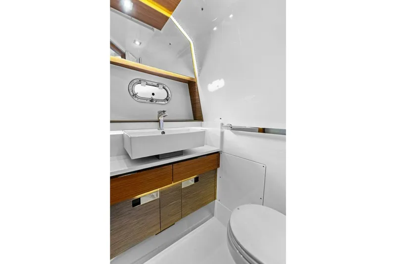 Luna B Yacht Photos Pics Luxurious bathroom interior of 2018 Tiara Yachts 38 LS with modern sink and cabinetry.