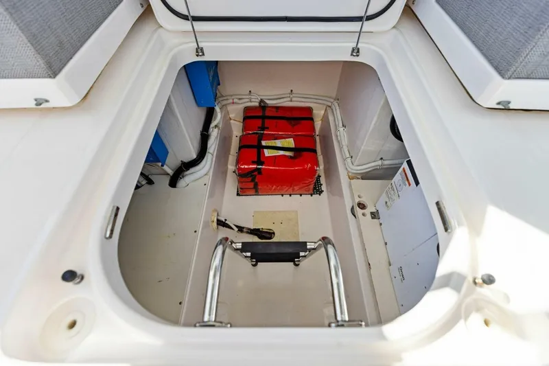 Luna B Yacht Photos Pics Storage compartment of 2018 Tiara Yachts 38 LS with safety equipment.