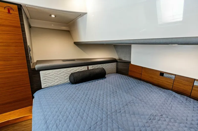 Luna B Yacht Photos Pics Interior cabin of 2018 Tiara Yachts 38 LS with modern bedding and wood accents.