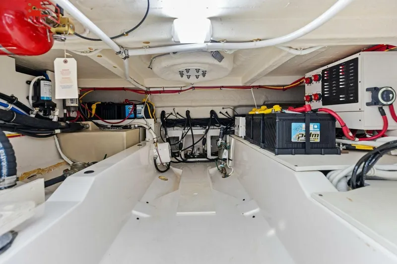 Luna B Yacht Photos Pics Engine compartment of 2018 Tiara Yachts 38 LS, showcasing wiring and battery systems.