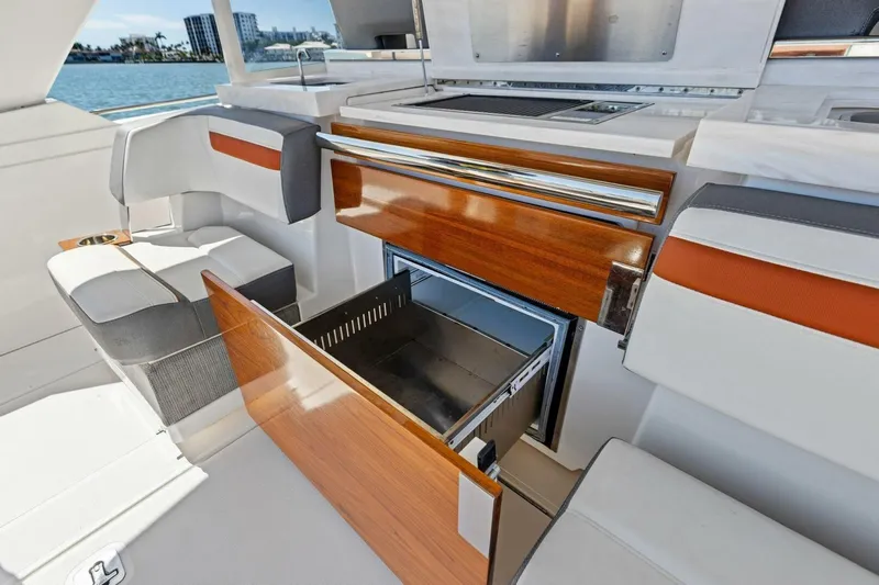 Luna B Yacht Photos Pics Luxurious interior of 2018 Tiara Yachts 38 LS with open storage compartment.