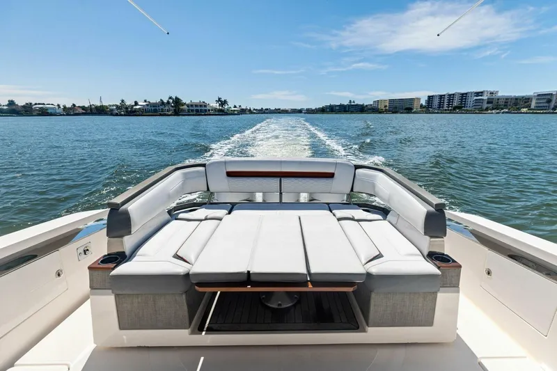 Luna B Yacht Photos Pics 2018 Tiara Yachts 38 LS cruising on water, featuring luxurious seating and scenic waterfront views.