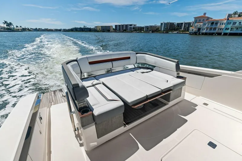 Luna B Yacht Photos Pics 2018 Tiara Yachts 38 LS luxury boat with spacious seating on a sunny day.