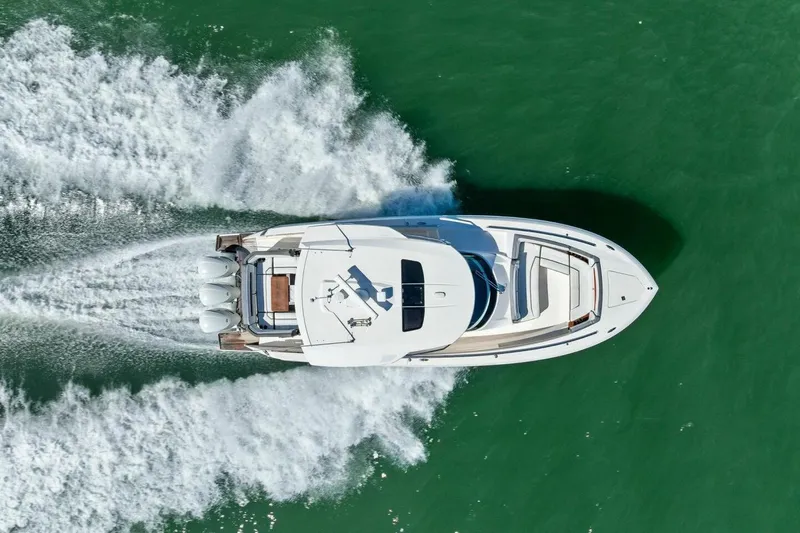Luna B Yacht Photos Pics Aerial view of 2018 Tiara Yachts 38 LS cruising on green water.