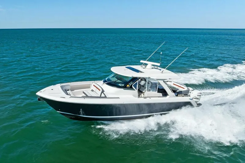 Luna B Yacht Photos Pics 2018 Tiara Yachts 38 LS cruising on open water, showcasing sleek design and performance.