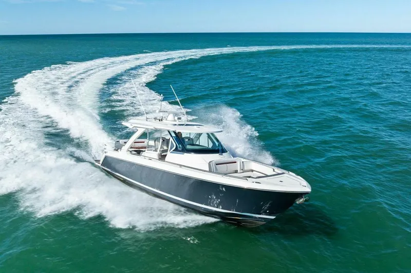 Luna B Yacht Photos Pics 2018 Tiara Yachts 38 LS cruising on open ocean, creating a dynamic water trail.