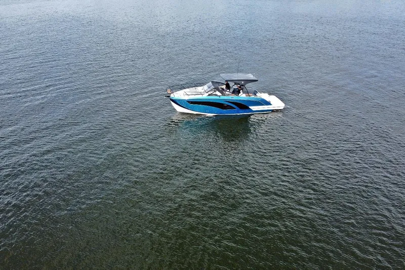  Yacht Photos Pics 2026 Hanover 327 boat cruising on calm waters, showcasing sleek design and modern features.