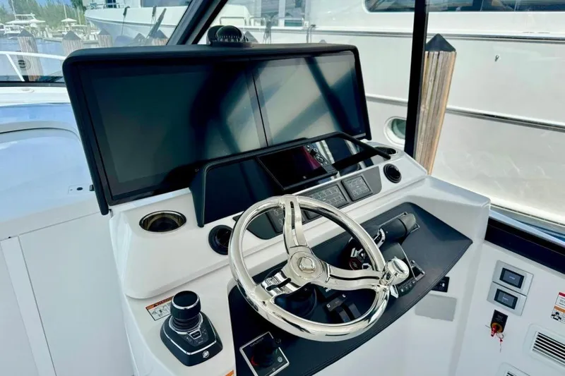  Yacht Photos Pics Helm of 2026 Intrepid 50 yacht with modern controls and dual screens.