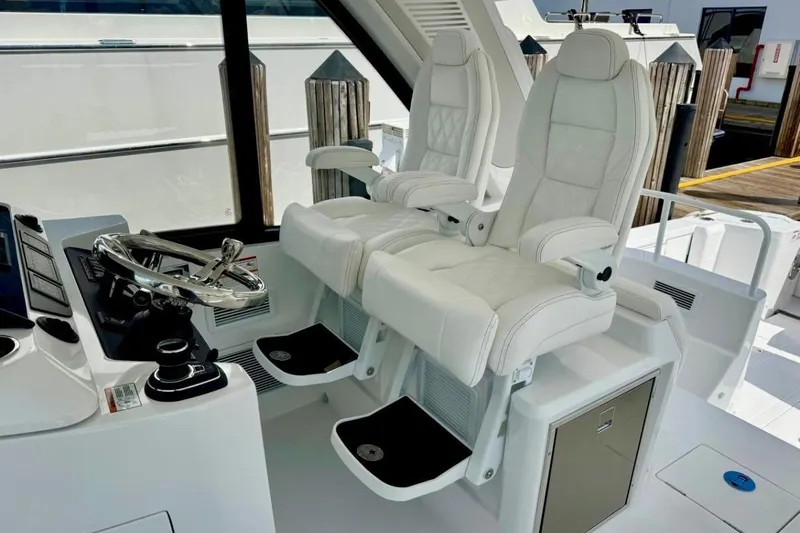  Yacht Photos Pics Luxury helm seats on 2026 Intrepid 50 yacht, featuring sleek design and modern controls.