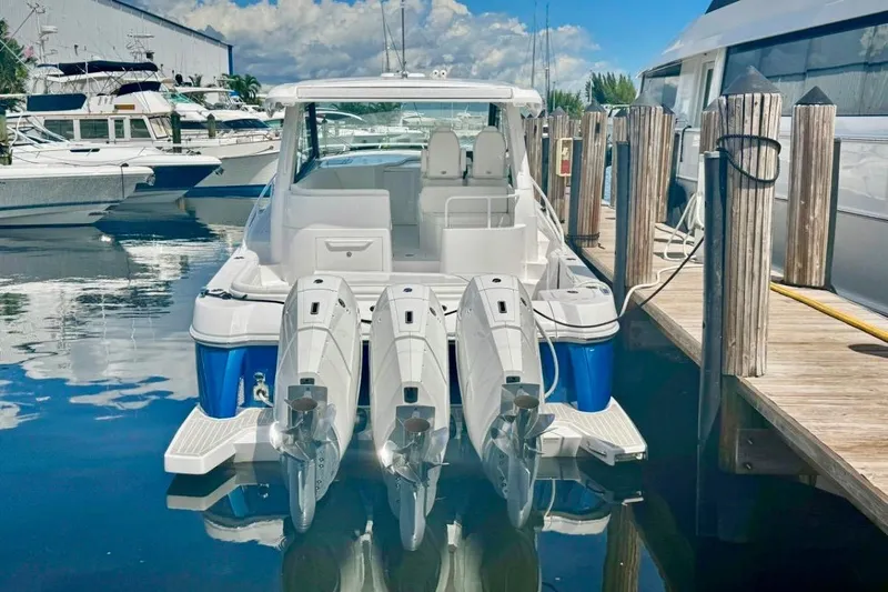  Yacht Photos Pics 2026 Intrepid 50 boat docked with four powerful outboard engines.