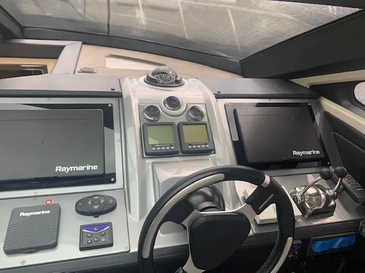  Yacht Photos Pics Control panel of 2008 Marquis 40 SC yacht with Raymarine navigation displays.