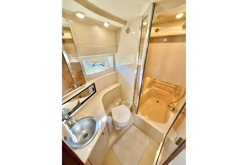  Yacht Photos Pics Luxurious bathroom in 2002 Bayliner 3988 Command Bridge Motoryacht with shower and sink.