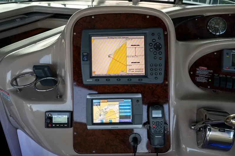 Murphys Law Yacht Photos Pics Control panel of a 2004 Sea Ray 380 Sundancer with navigation and communication equipment.
