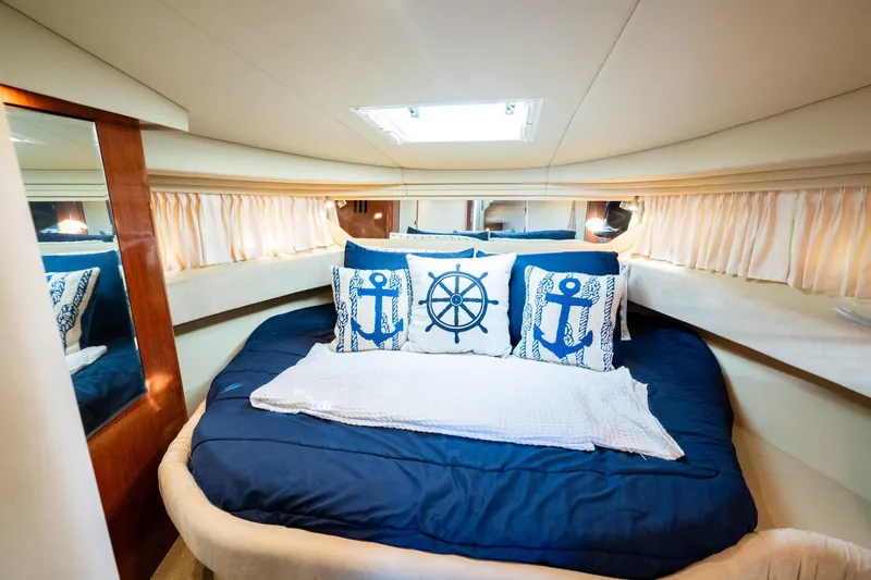 Murphys Law Yacht Photos Pics Luxurious cabin interior of 2004 Sea Ray 380 Sundancer with nautical-themed decor.