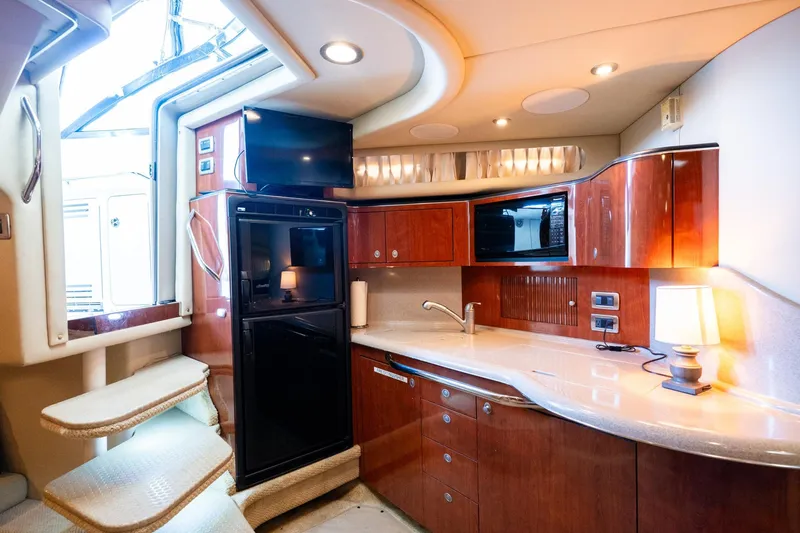 Murphys Law Yacht Photos Pics Luxurious 2004 Sea Ray 380 Sundancer yacht interior with modern kitchen amenities.
