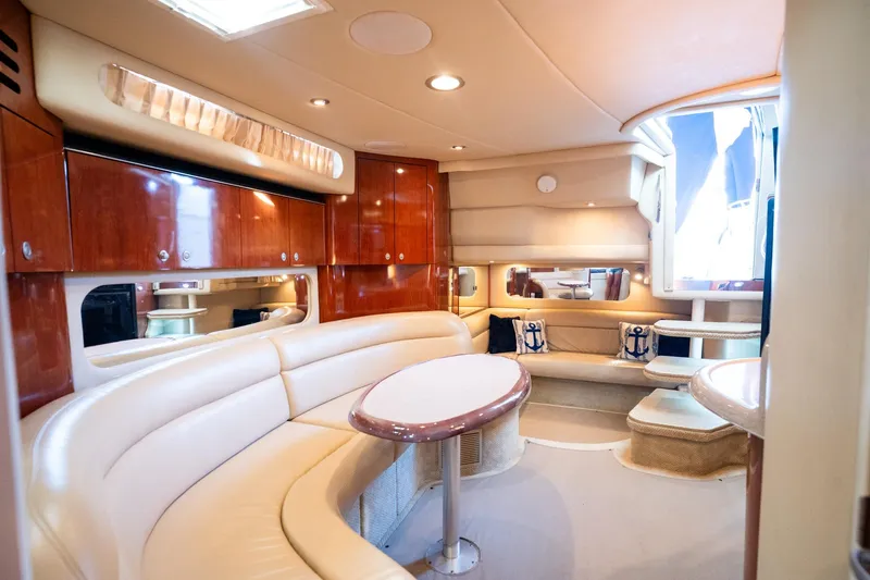 Murphys Law Yacht Photos Pics Luxurious interior of 2004 Sea Ray 380 Sundancer yacht with elegant seating and wood finishes.