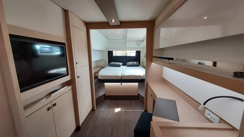 Super Trouper Yacht Photos Pics Luxurious interior of 2019 Fountaine Pajot Saona 47 catamaran with modern furnishings and cozy bedroom.