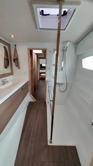 Super Trouper Yacht Photos Pics Interior of 2019 Fountaine Pajot Saona 47 catamaran, featuring modern bathroom design.