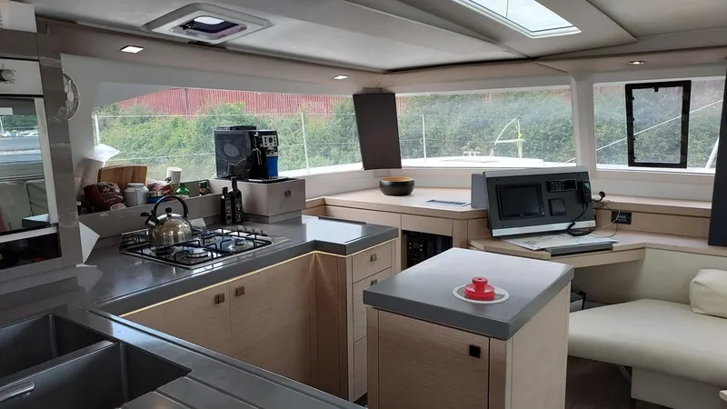Super Trouper Yacht Photos Pics Interior of 2019 Fountaine Pajot Saona 47 yacht, featuring modern kitchen and navigation area.