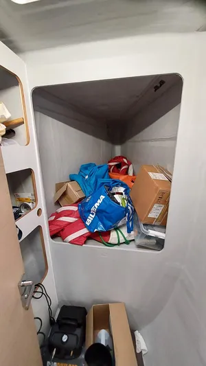 Super Trouper Yacht Photos Pics Storage area inside 2019 Fountaine Pajot Saona 47, filled with boxes and bags.