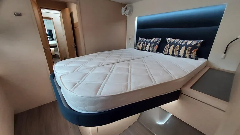 Super Trouper Yacht Photos Pics Luxurious cabin interior of 2019 Fountaine Pajot Saona 47 catamaran with modern bedding.